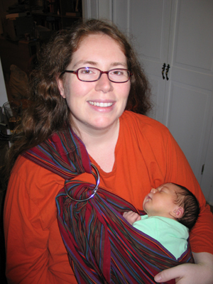 7 days old, snuggled up in a sling with mommy