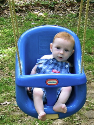Karl in a blue swing