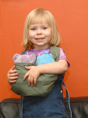 Erika carrying two bears in a sling
