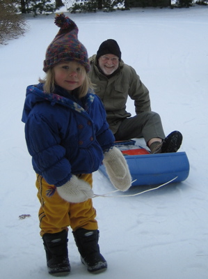 Grandpa on sled, Erika holding rope